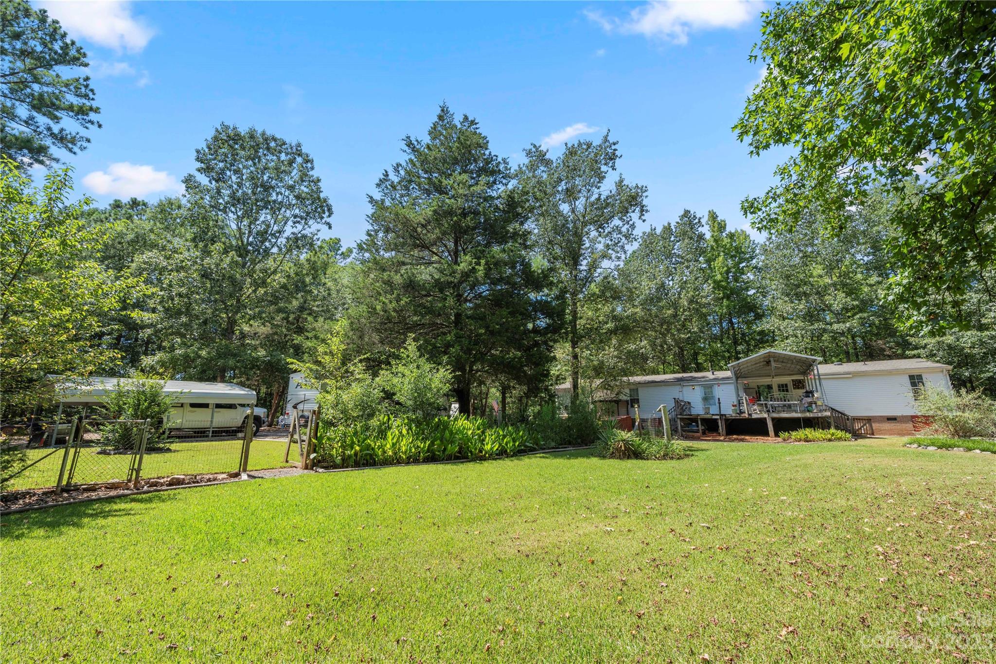 442 Tirzah Church Road Lancaster, SC 29720 - Photo 23 of 29 a view of a house with a backyard