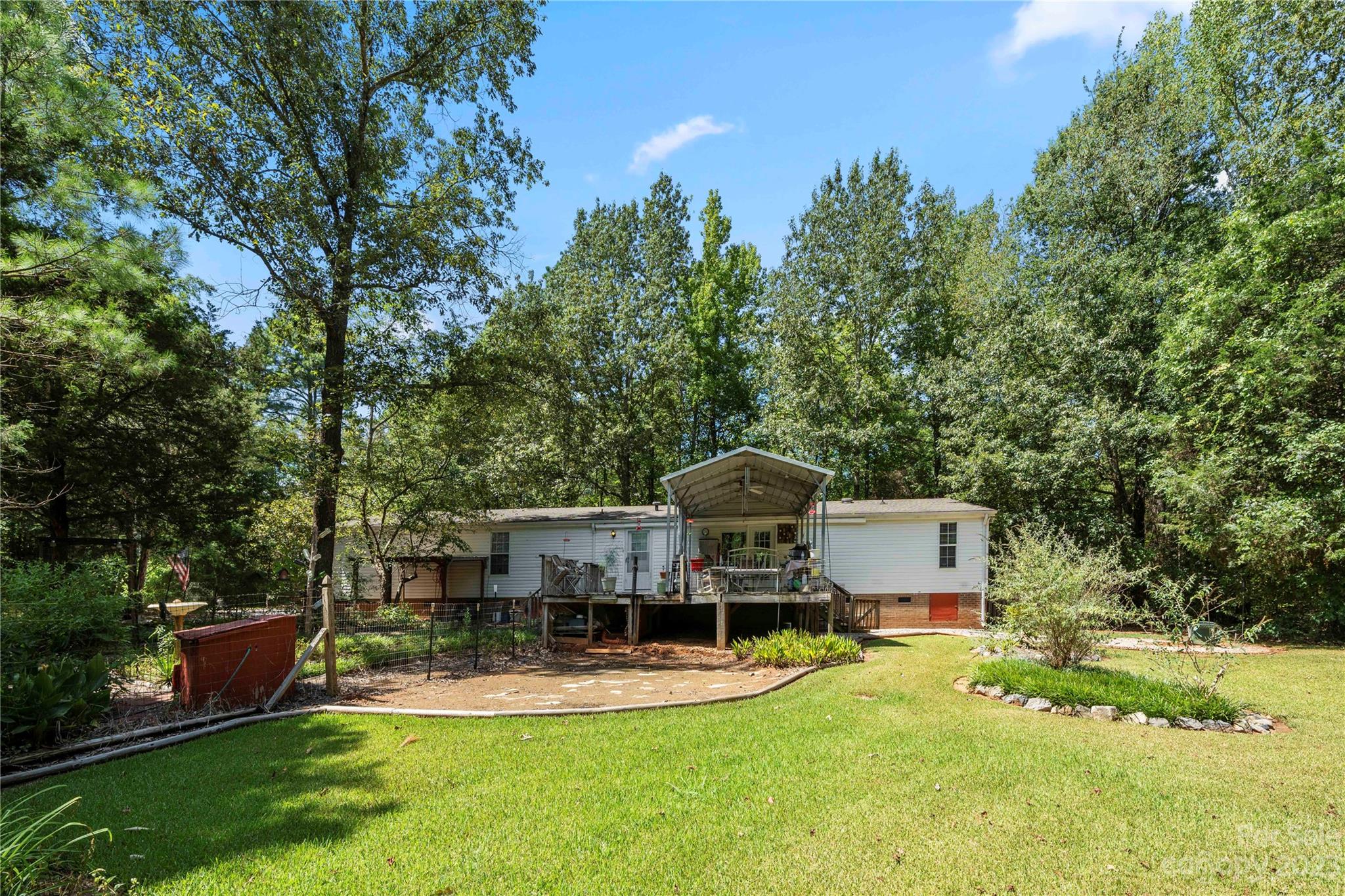442 Tirzah Church Road Lancaster, SC 29720 - Photo 24 of 29 a swimming pool with outdoor seating and yard