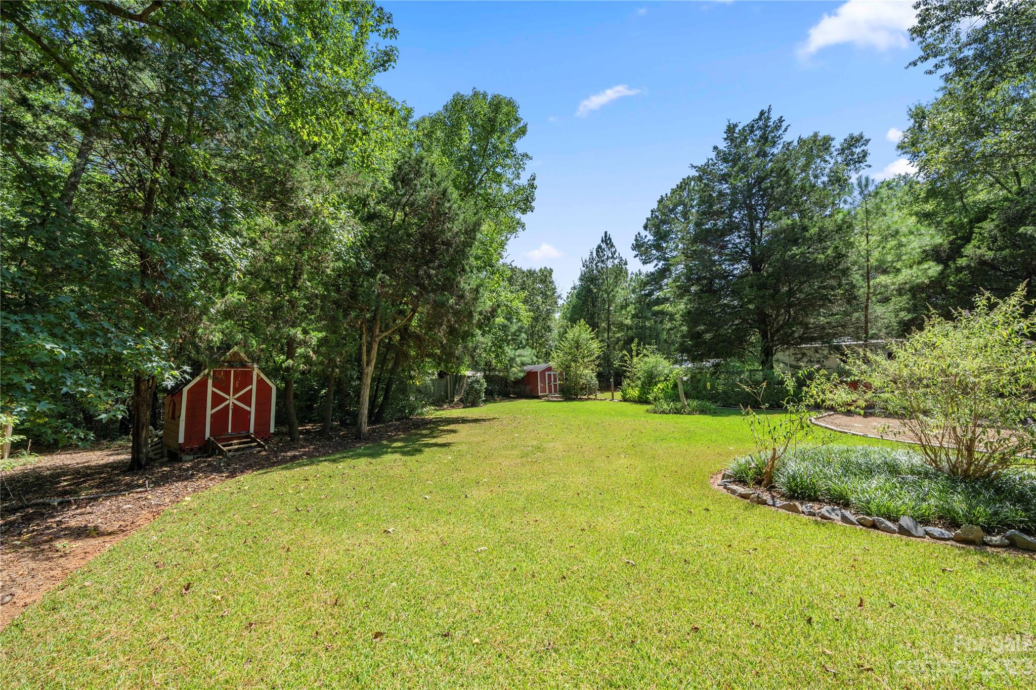 442 Tirzah Church Road Lancaster, SC 29720 - Photo 26 of 29 a view of a backyard with swimming pool