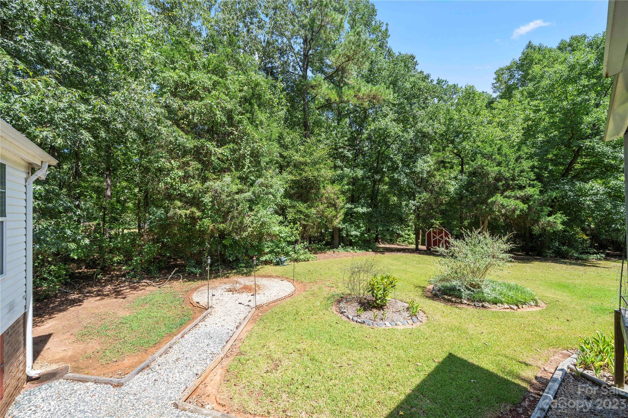 442 Tirzah Church Road Lancaster, SC 29720 - Photo 27 of 29 a view of a backyard with large trees