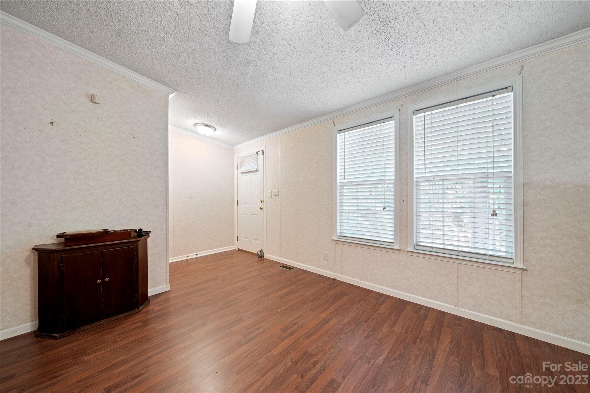442 Tirzah Church Road Lancaster, SC 29720 - Photo 5 of 29 a view of an empty room with a window and wooden floor