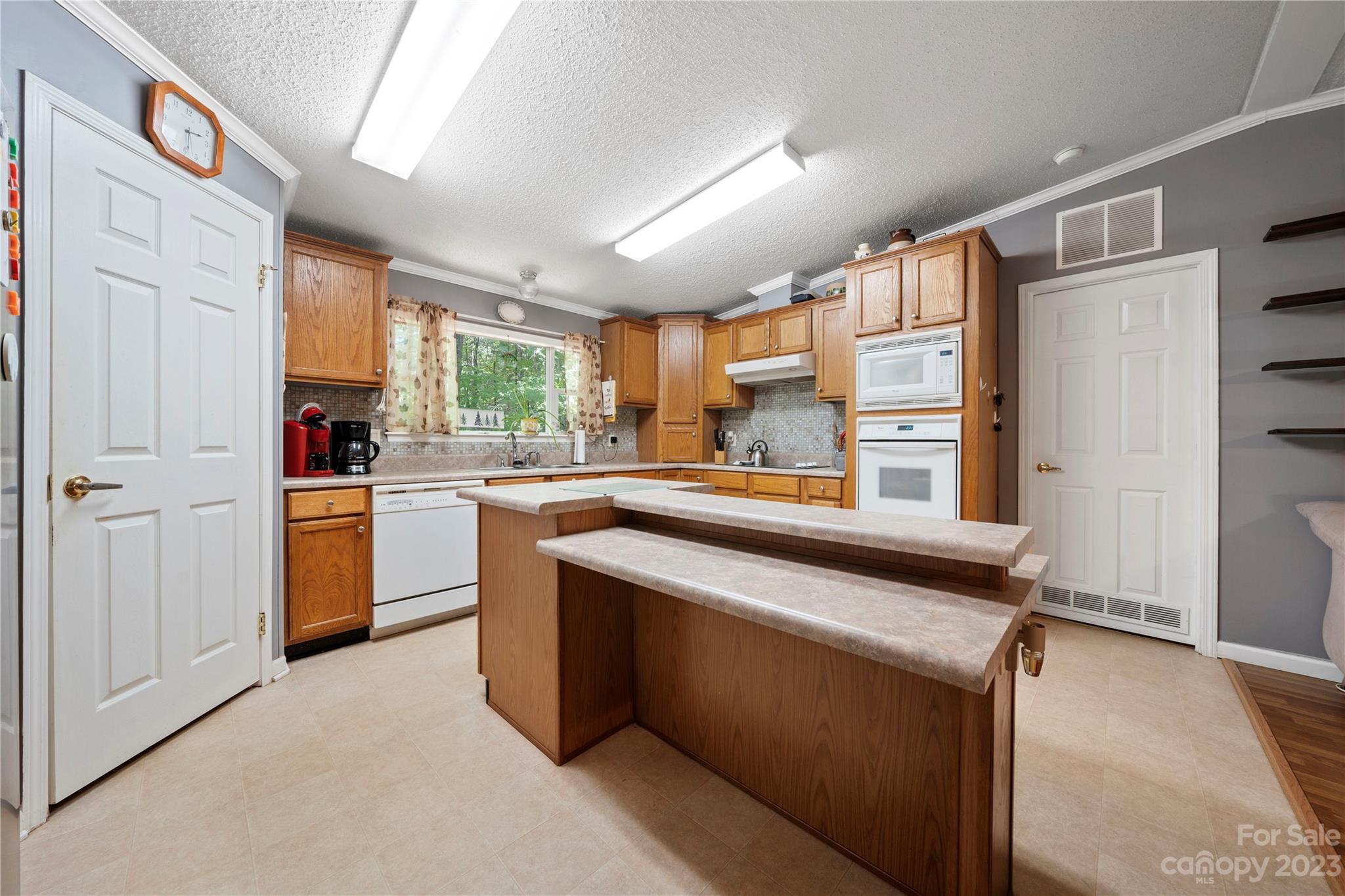442 Tirzah Church Road Lancaster, SC 29720 - Photo 9 of 29 a kitchen with a sink appliances cabinets and a large window