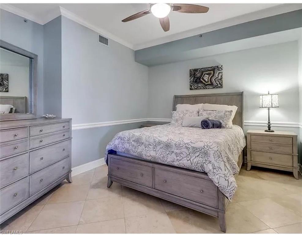 4650 Yacht Harbor Drive, Unit 125 Naples, FL 34112 - Photo 15 of 20 a bedroom with a bed and a closet