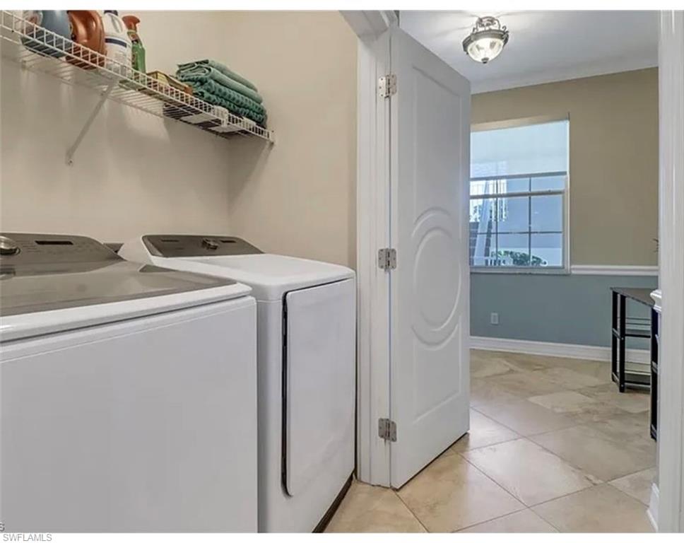 4650 Yacht Harbor Drive, Unit 125 Naples, FL 34112 - Photo 19 of 20 a utility room with dryer and washer