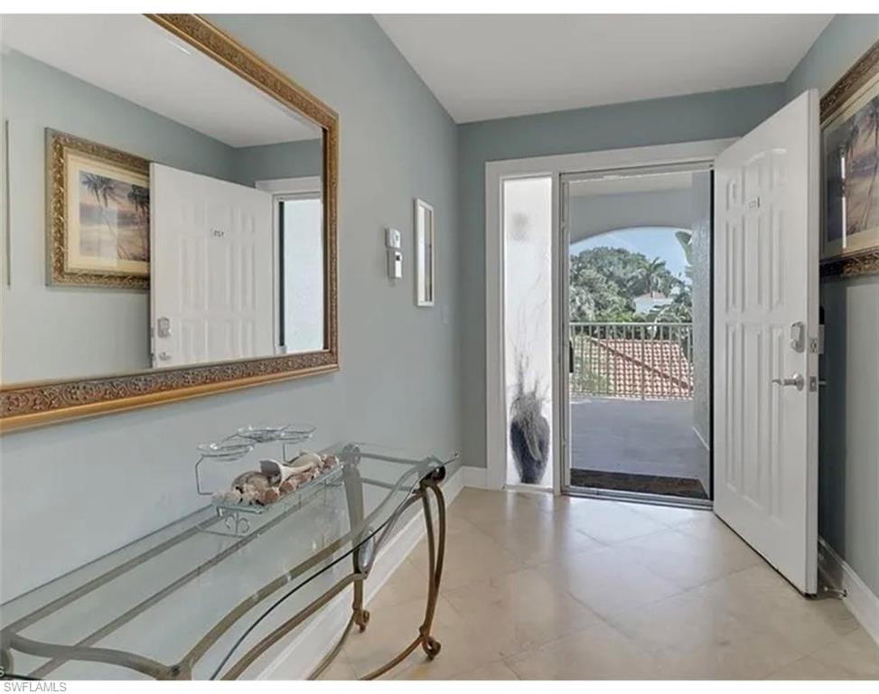 4650 Yacht Harbor Drive, Unit 125 Naples, FL 34112 - Photo 3 of 20 a room with furniture and a window