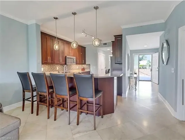 a kitchen with stainless steel appliances granite countertop cabinets a stove a sink and dishwasher