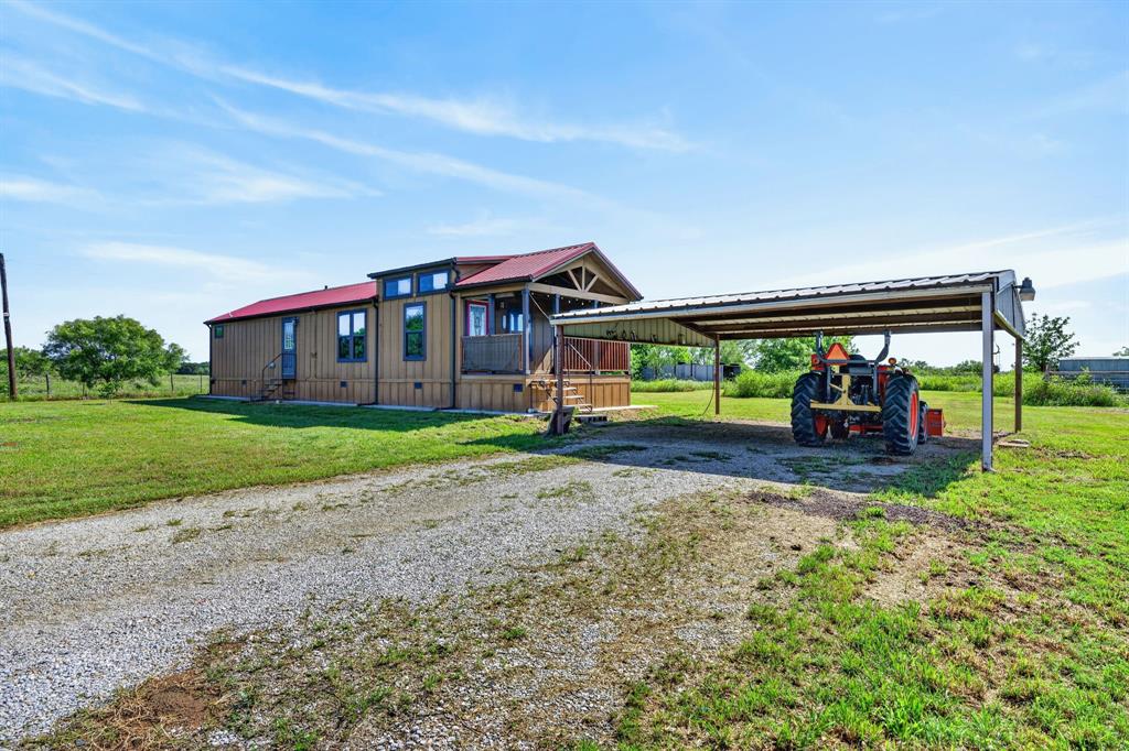 2401 Lamkin Road Mineral Wells, TX 76067 - Photo 3 of 36 a view of a house with a yard