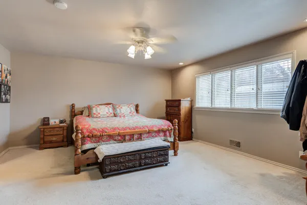 a bedroom with a bed and window