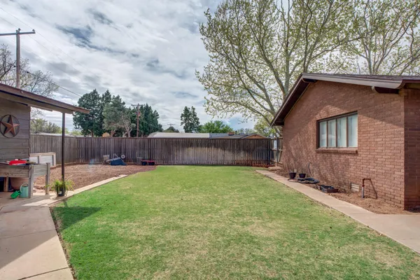 a backyard of a house with lots of green space