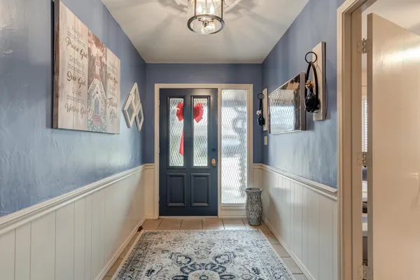 a hallway with sliding door and stairs