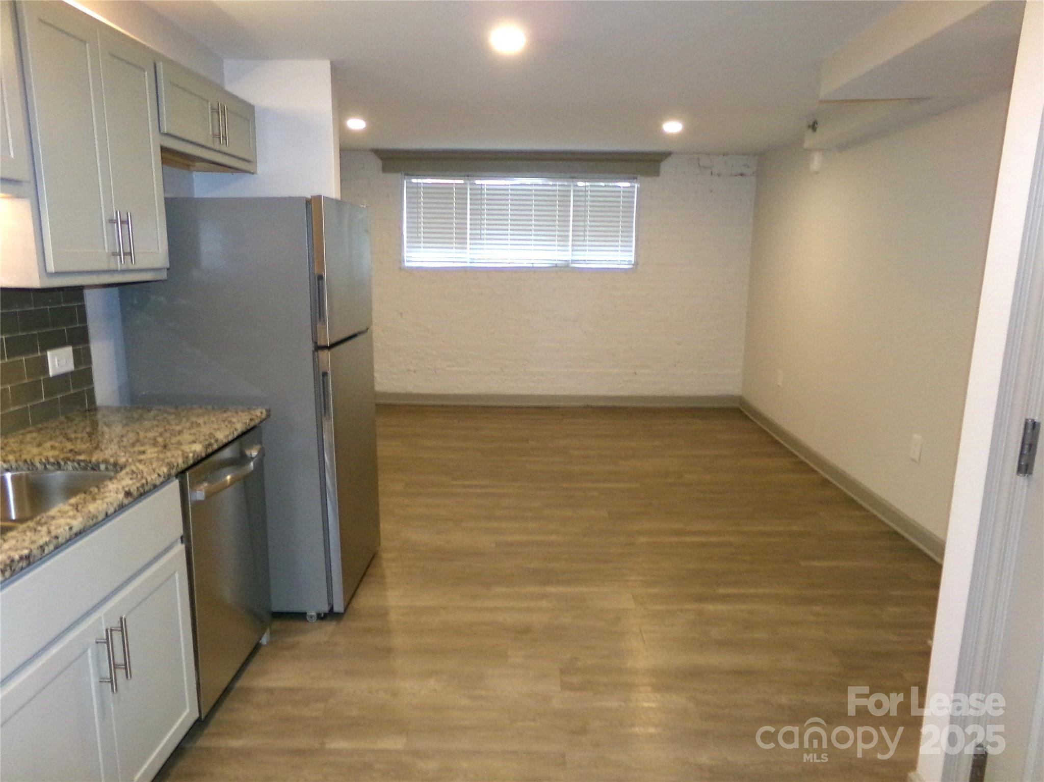 197 North 2nd Street, Unit 5 Albemarle, NC 28001 - Photo 3 of 12 a view of a kitchen with a sink