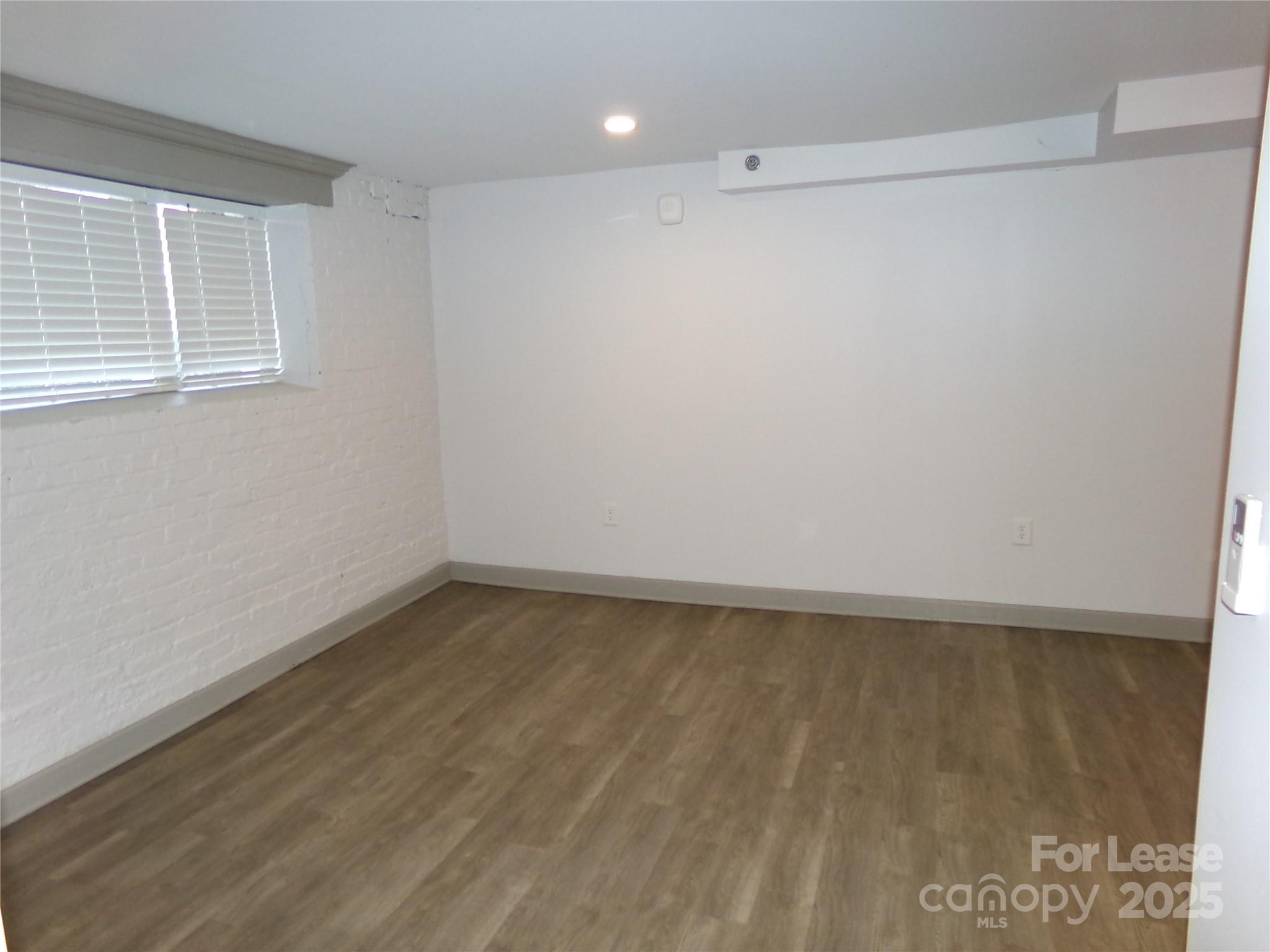 197 North 2nd Street, Unit 5 Albemarle, NC 28001 - Photo 6 of 12 a view of an empty room with a window