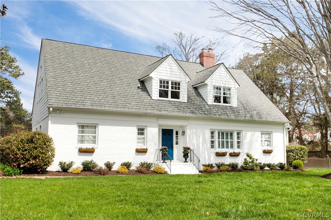 7202 River Road Henrico, VA 23229 - Photo 1 of 49 a front view of a house with a garden and plants