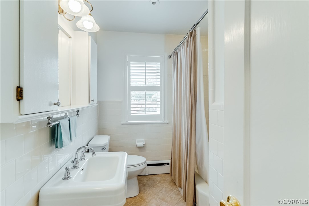 7202 River Road Henrico, VA 23229 - Photo 17 of 49 a bathroom with a sink a toilet and a mirror