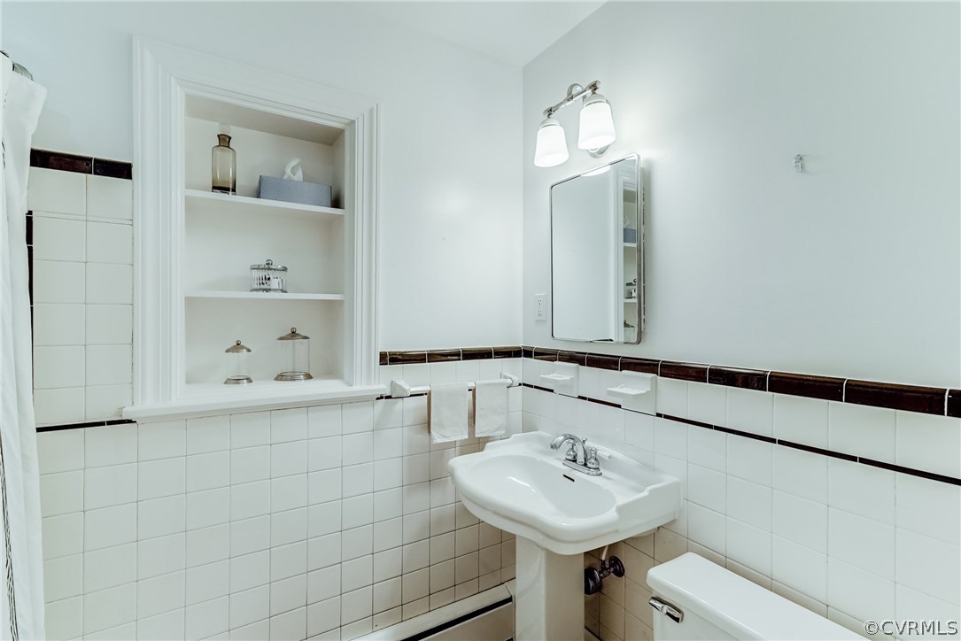 7202 River Road Henrico, VA 23229 - Photo 19 of 49 a bathroom with a sink and a mirror