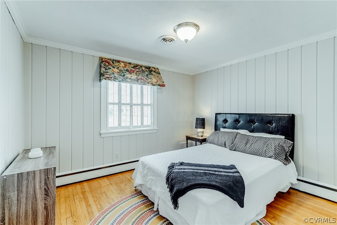 7202 River Road Henrico, VA 23229 - Photo 20 of 49 a bedroom with a bed and a large window