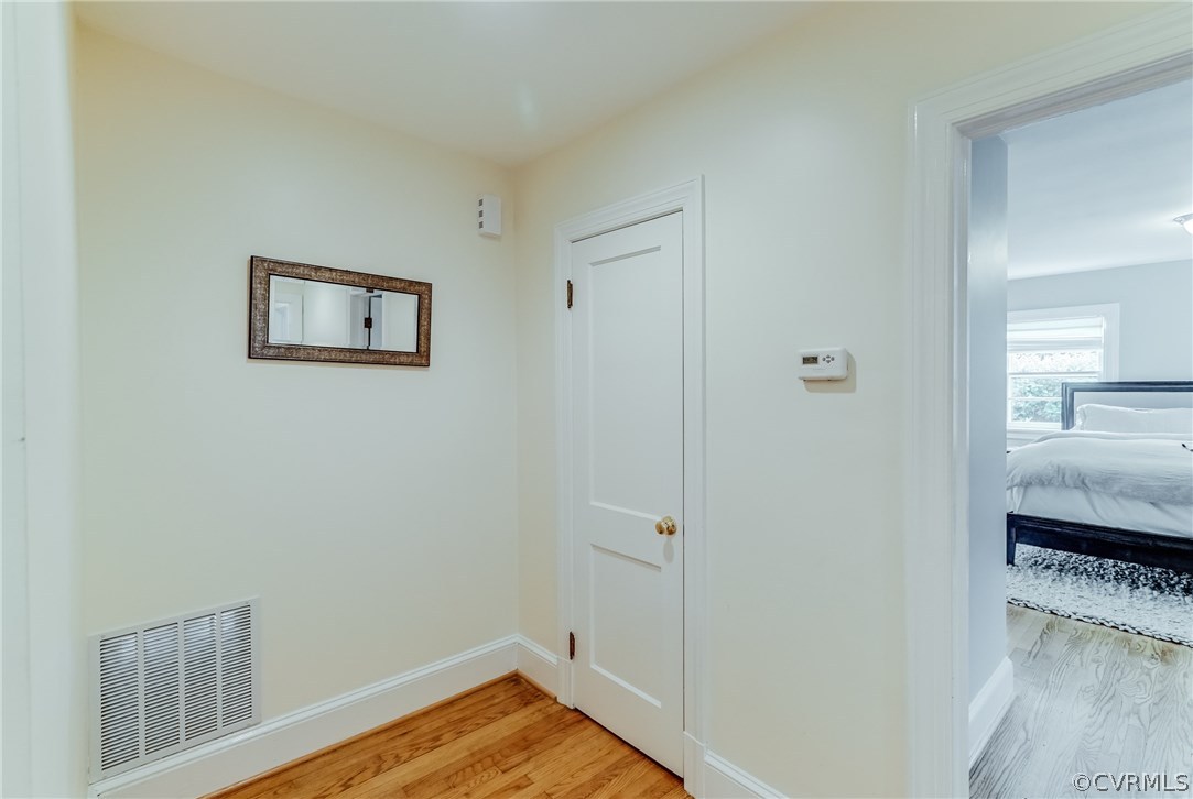 7202 River Road Henrico, VA 23229 - Photo 22 of 49 a view of a room that has a bed and wooden floor