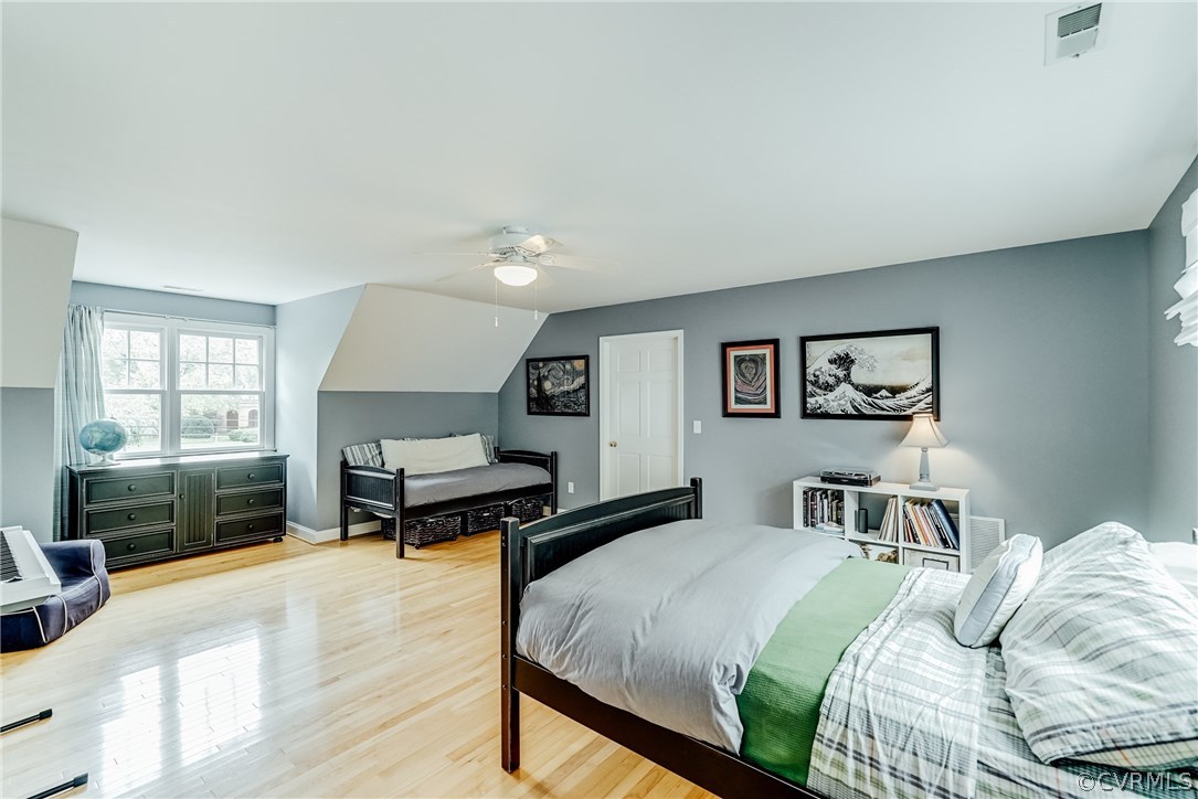 7202 River Road Henrico, VA 23229 - Photo 32 of 49 a bedroom with a bed and wooden floor