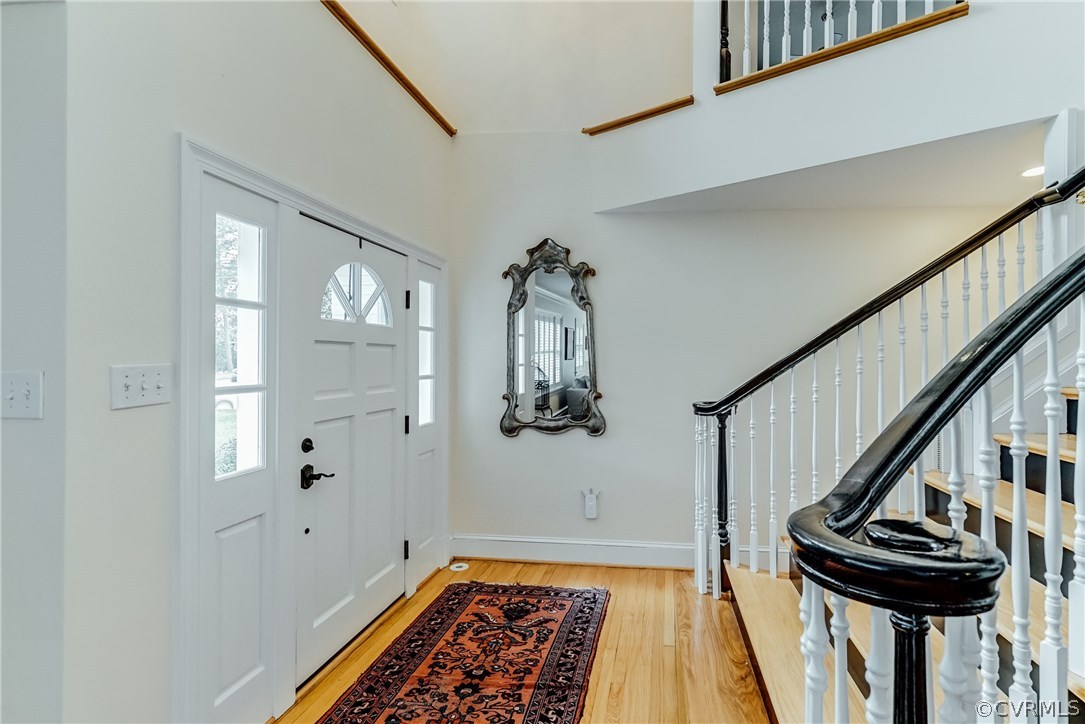 7202 River Road Henrico, VA 23229 - Photo 4 of 49 a view of hallway with stairs and wooden floor