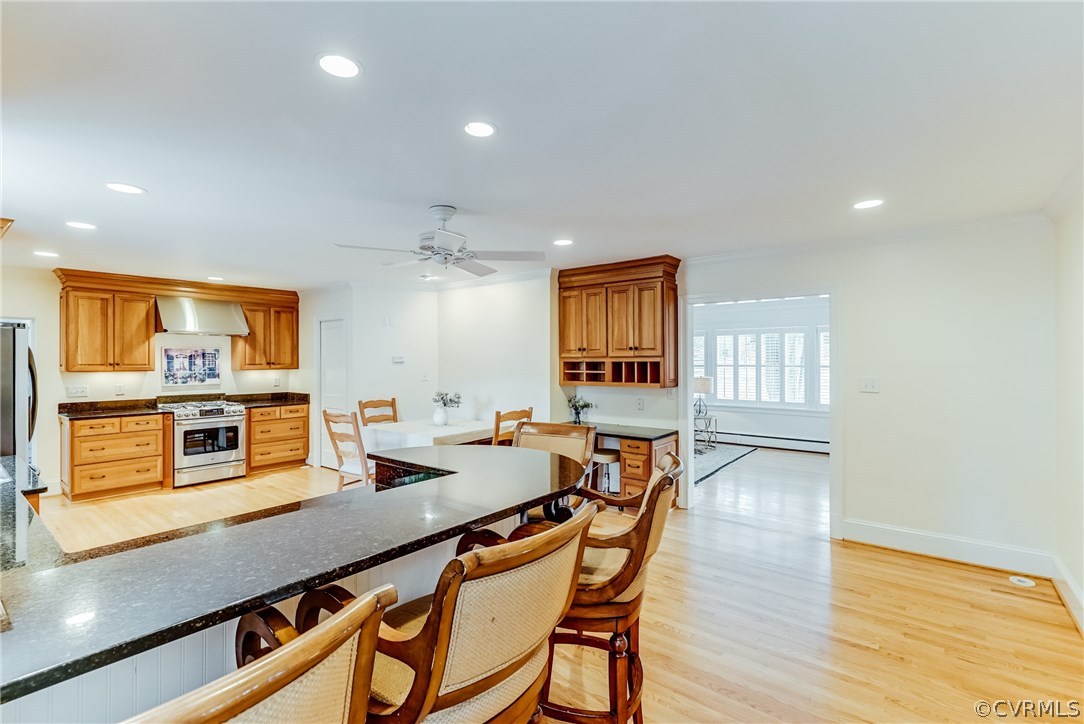 7202 River Road Henrico, VA 23229 - Photo 42 of 49 a kitchen with a table chairs and wooden floor