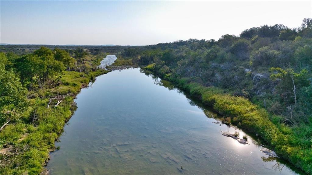 4900 State Highway 71 Voca, TX 76887 - Photo 3 of 29 a view of a lake with a yard