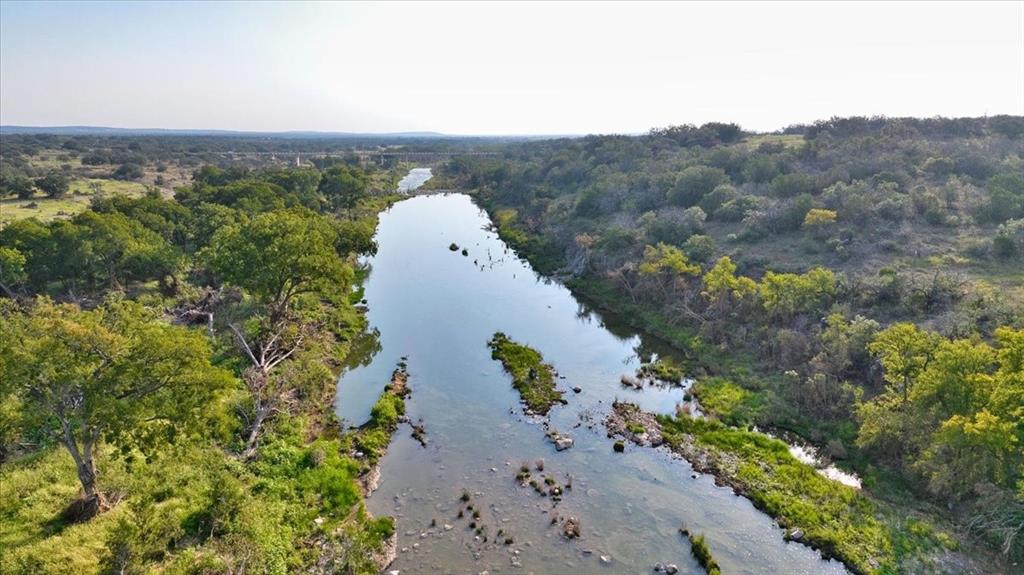 4900 State Highway 71 Voca, TX 76887 - Photo 5 of 29 an aerial view of a house with a yard and mountain in the back