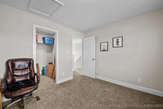 a view of room with workspace and mirror