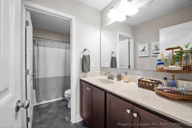 a bathroom with a sink double vanity and a mirror