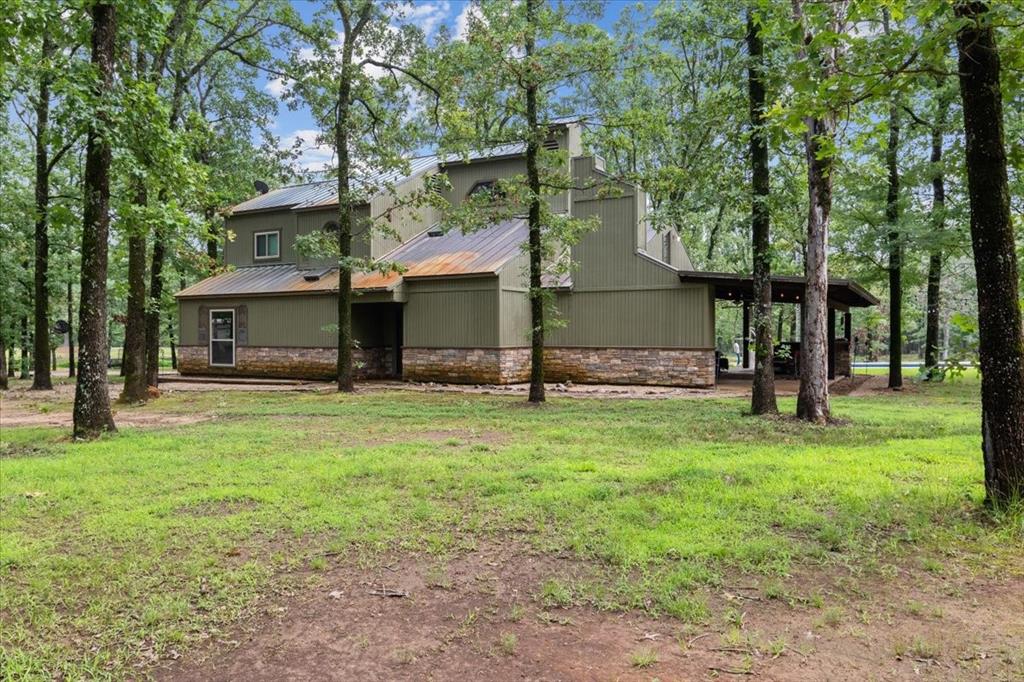 474 County Road Paris, TX 75462 - Photo 1 of 1 View of home's exterior featuring a yard