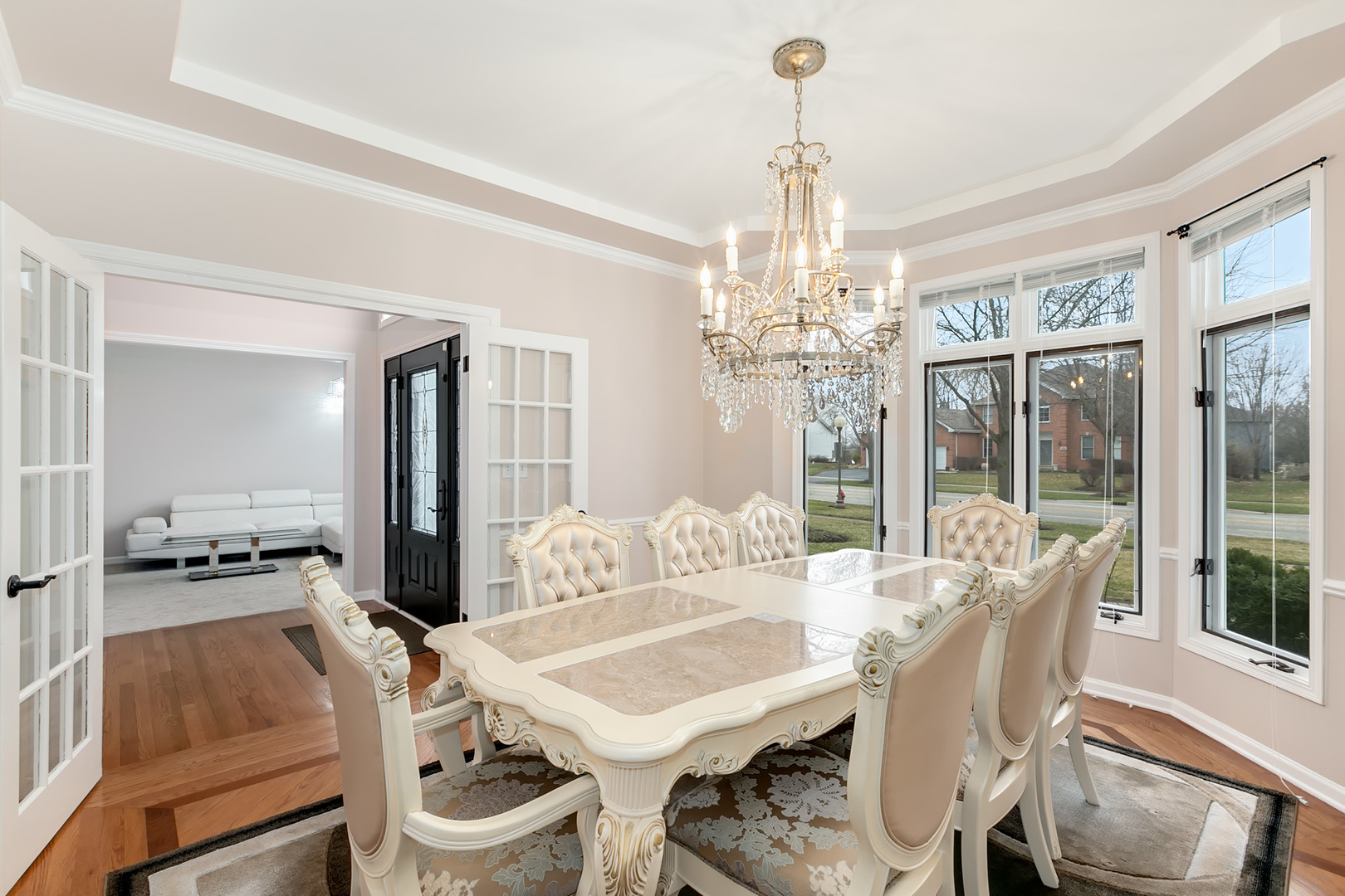464 Lewis Road Geneva, IL 60134 - Photo 5 of 33 a view of a dining room with furniture large windows and wooden floor