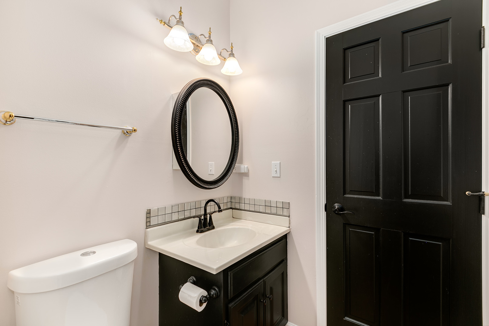 464 Lewis Road Geneva, IL 60134 - Photo 6 of 33 a bathroom with a sink a toilet and a mirror
