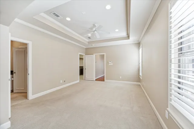 a large bathroom with a granite countertop tub sink shower and mirror