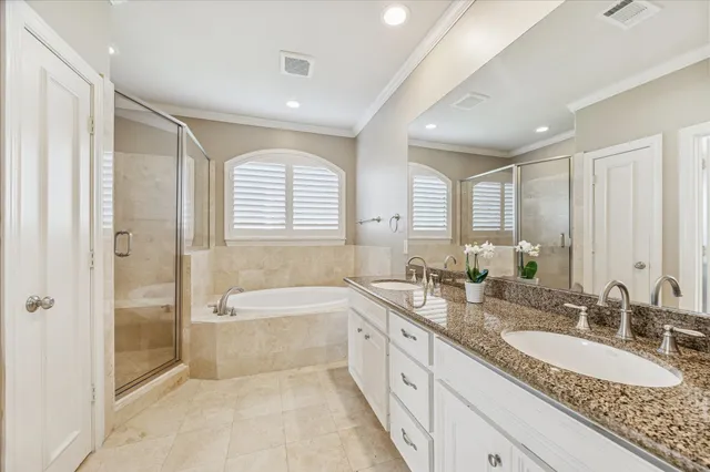 a spacious bedroom with a bed and a large window