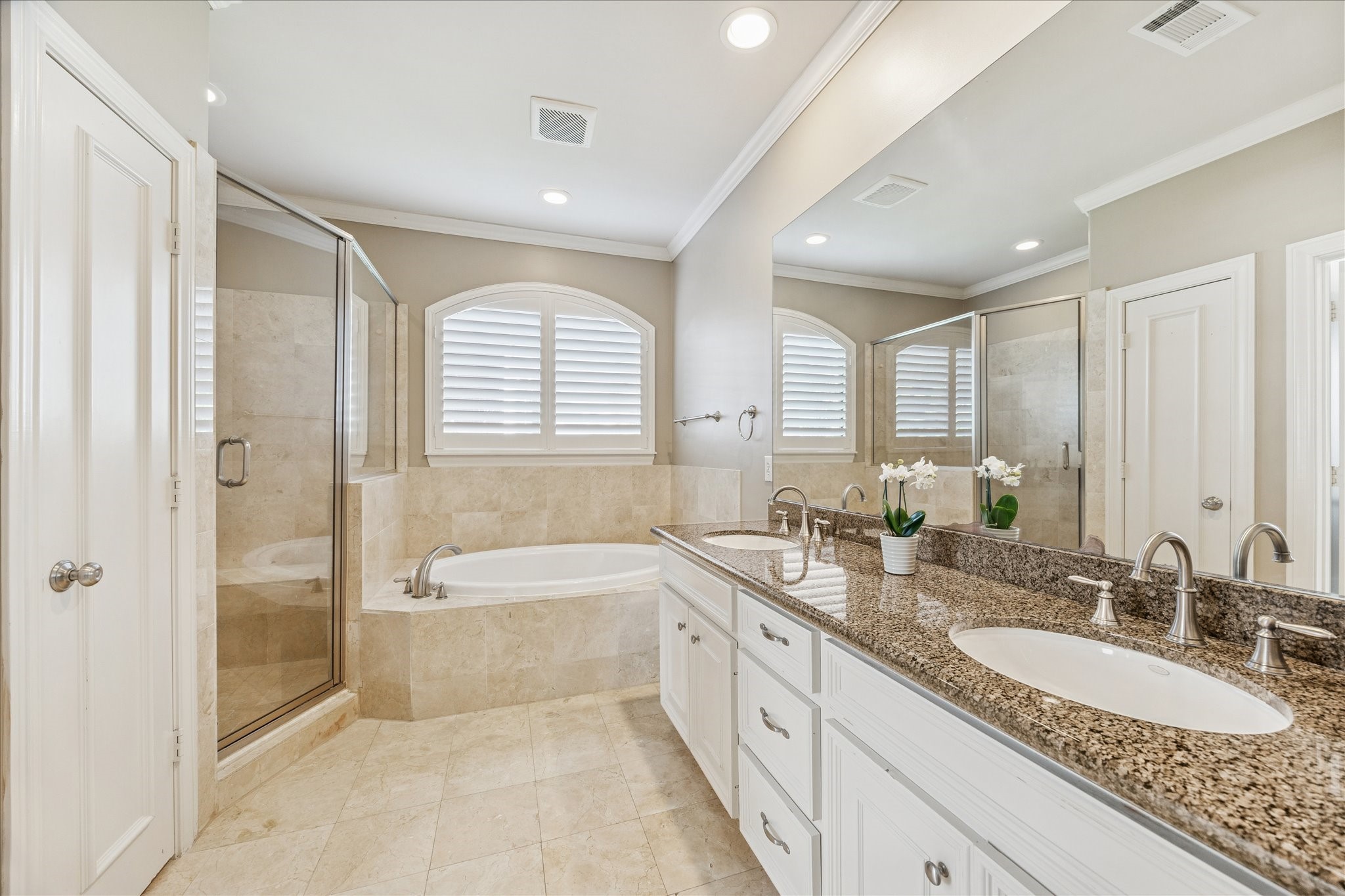 1712 McDuffie Street Houston, TX 77019 - Photo 14 of 27 a large bathroom with a granite countertop tub sink shower and mirror