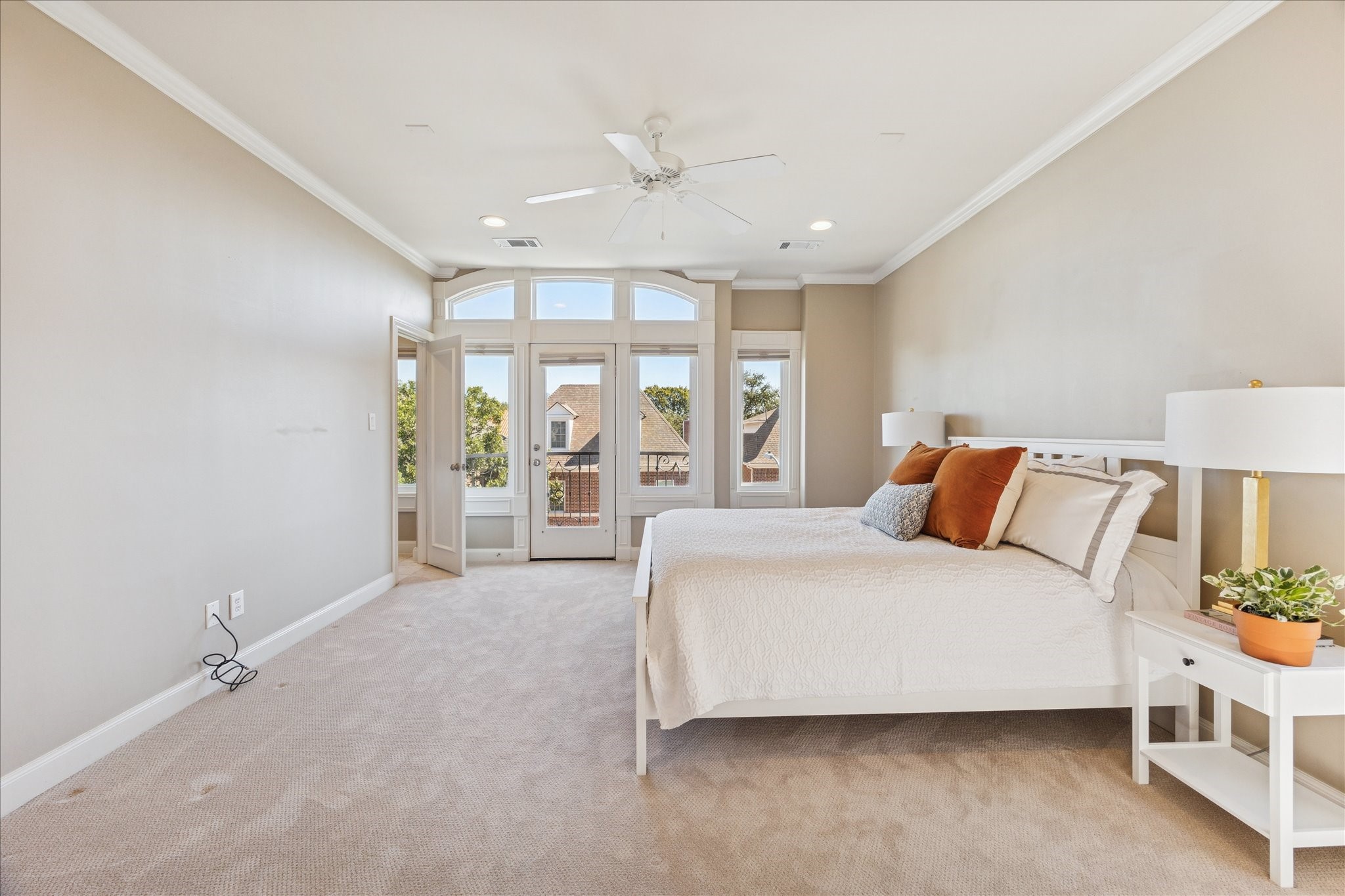 1712 McDuffie Street Houston, TX 77019 - Photo 15 of 27 a spacious bedroom with a bed and a large window