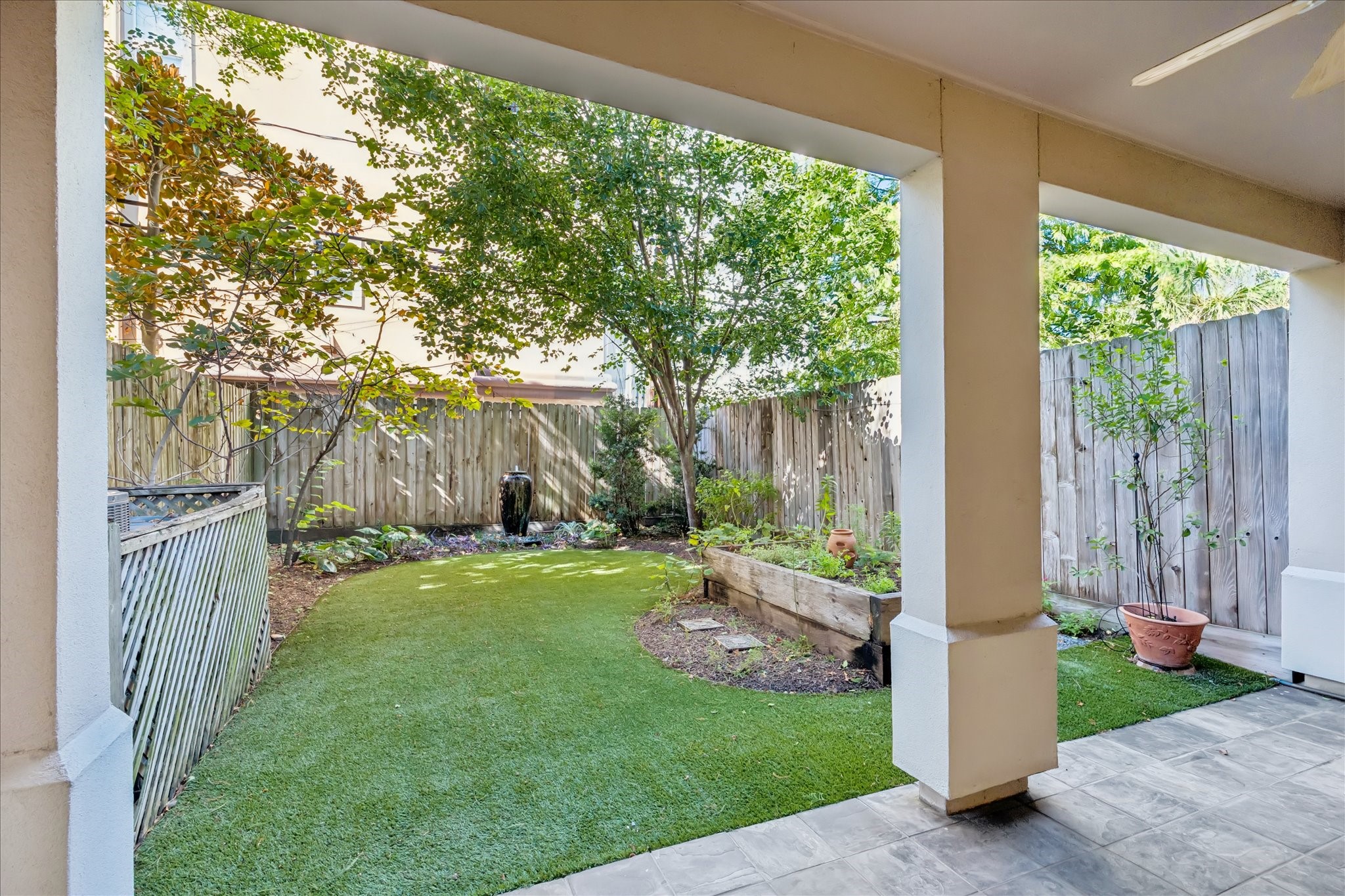 1712 McDuffie Street Houston, TX 77019 - Photo 2 of 27 a view of backyard with large trees and a big yard