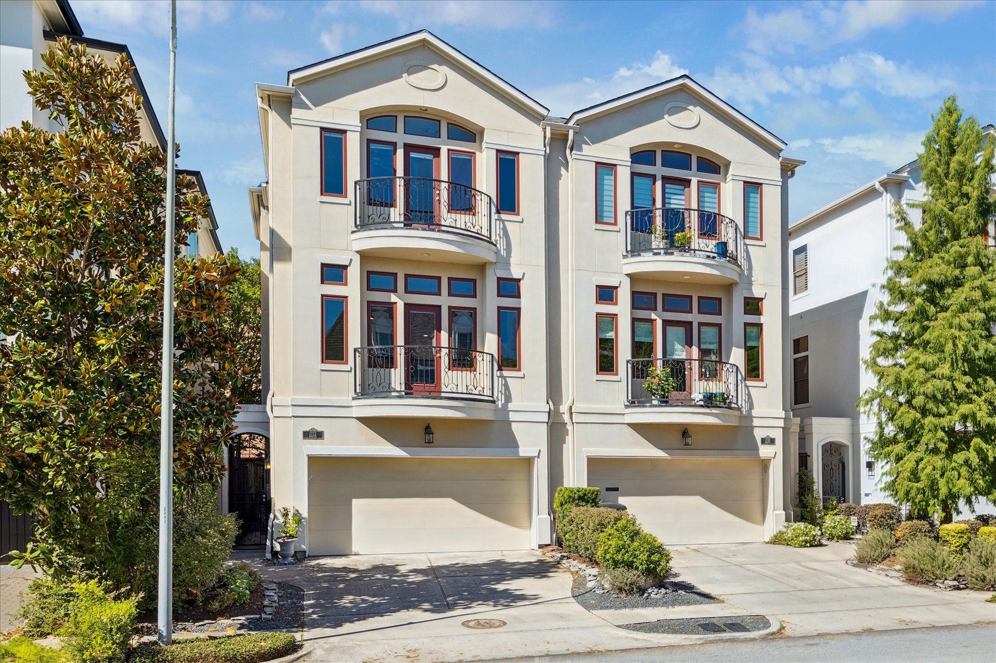1712 McDuffie Street Houston, TX 77019 - Photo 27 of 27 a front view of a building with a garden