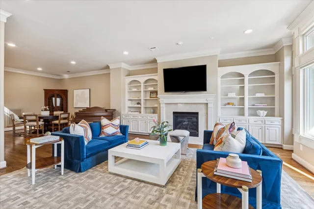 a living room with furniture fireplace and a flat screen tv