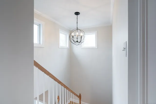 a view of a hallway with windows
