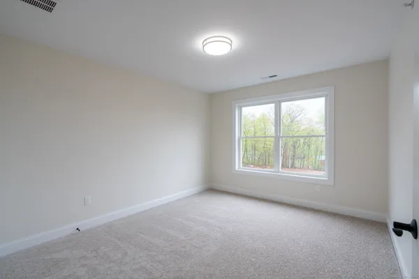 a kitchen with stainless steel appliances granite countertop a stove and a wooden floors