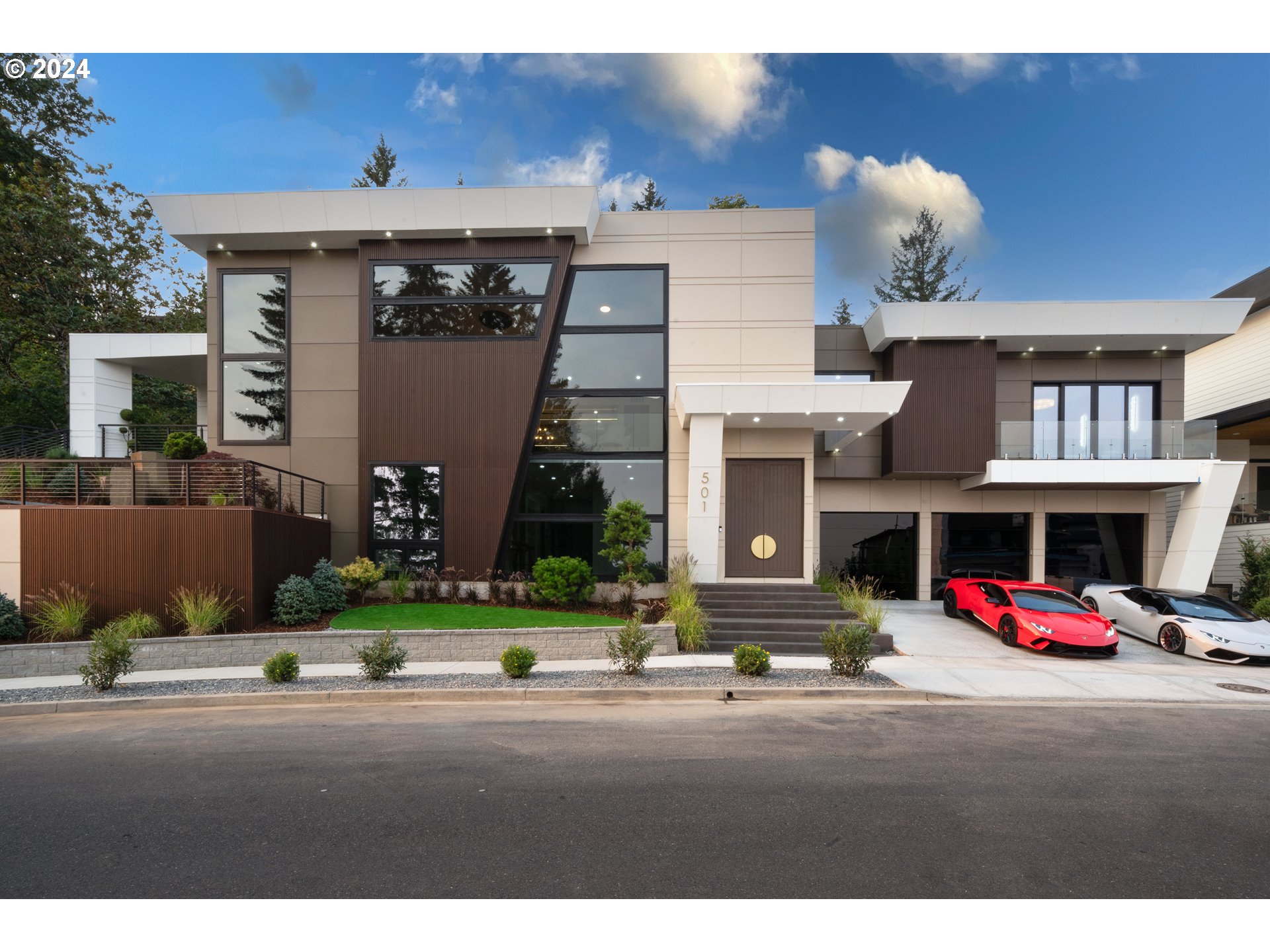 a view of multiple houses with a street