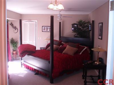 8550 Corriente Road Atascadero, CA 93422 - Photo 11 of 15 a living room with furniture and a chandelier