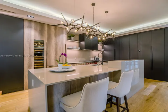 a kitchen with a table and chairs in it
