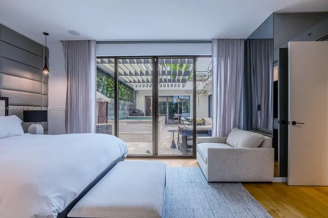 a bedroom with a large bed and a couch