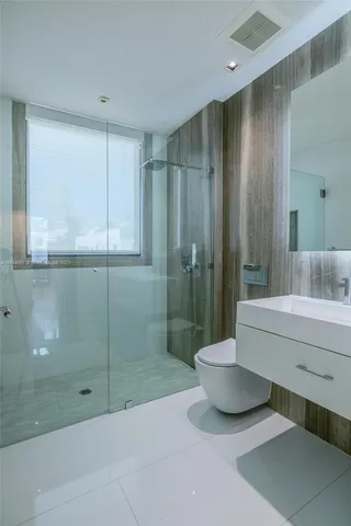 a bathroom with a shower and a tub