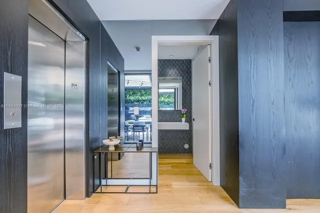 a view of a patio with table and chairs potted plants with wooden floor