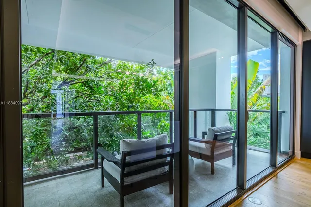 a view of a two chairs in the balcony