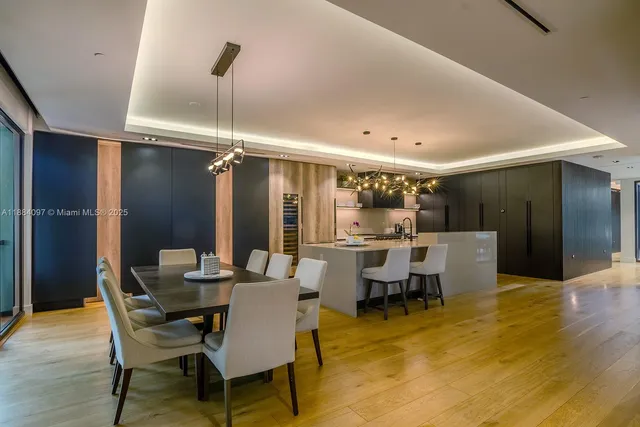 a view of a dining room with furniture and chandelier