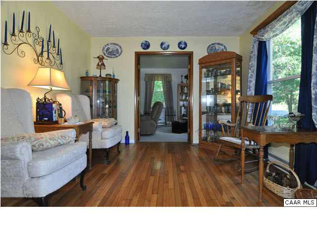 The living room boasts gleaming hardwood floors, as does most of the home.