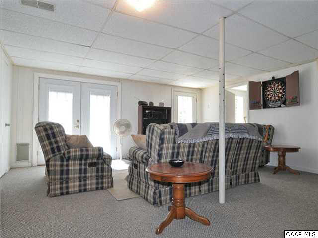 126 North Boston Road Troy, VA 22974 - Photo 25 of 39 Double doors and large windows make this walk-out basement bright on the inside.